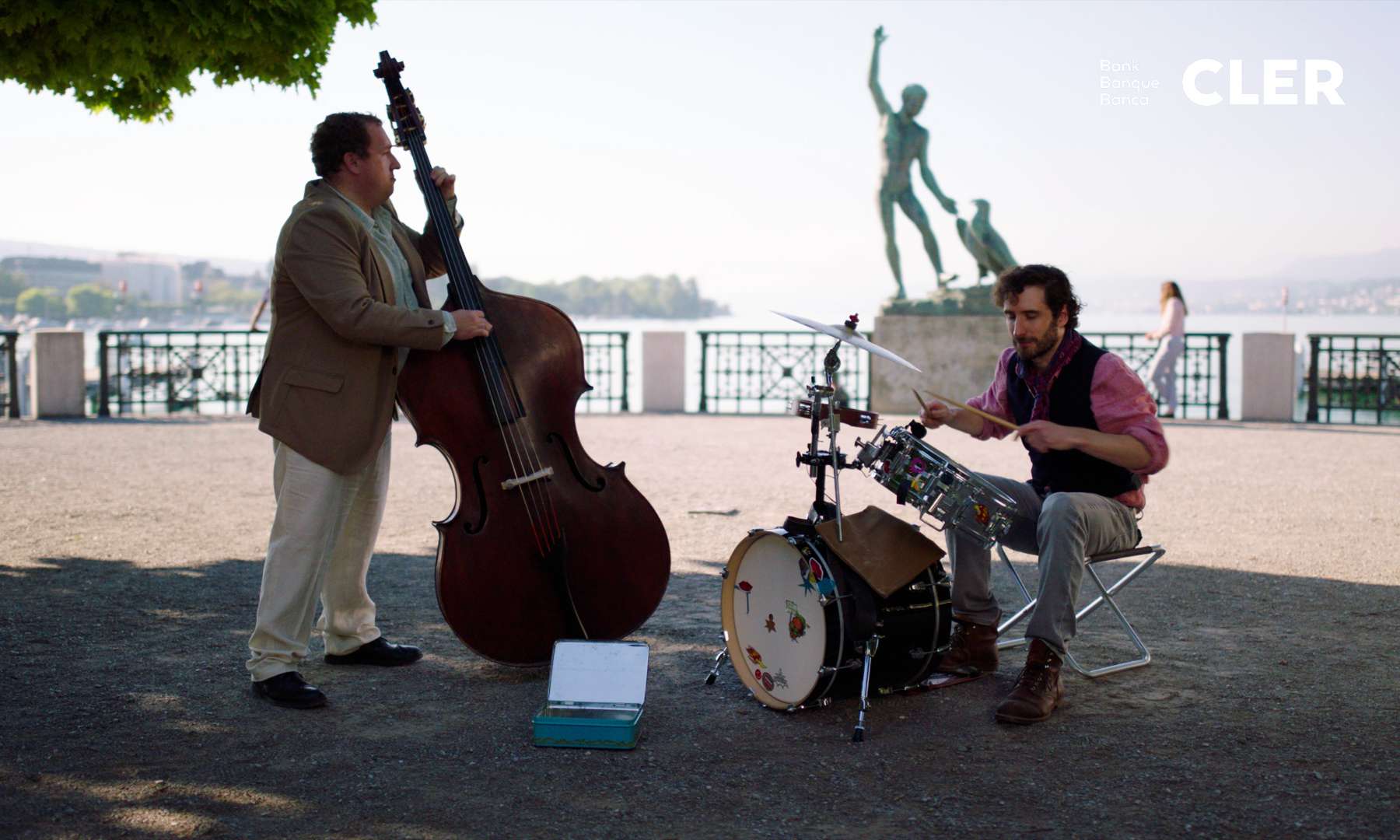 Two musicians playing the double bass and the drums on the famous Bürkliplatz in Zurich.