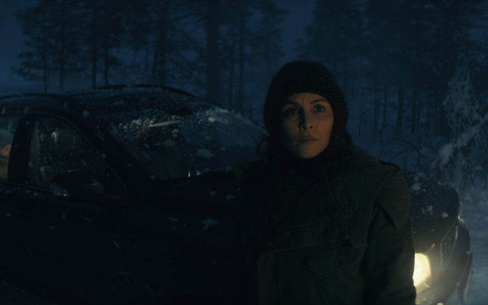 Davina Coleman and Lucy Coleman in the dark in a forest in the series Constellation on Apple TV+ with Virtual Production Supervision by Adrian Weber.
