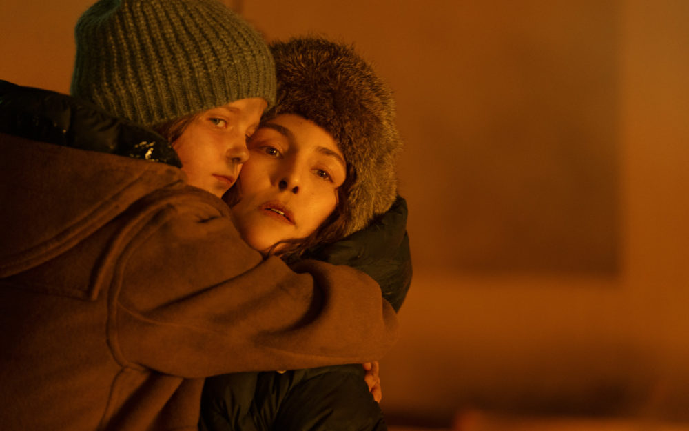 Noomie Rapace carrying Davina Coleman from a fire in the Apple TV+ Series Constellation with Virtual Production Supervision by Adrian Weber.