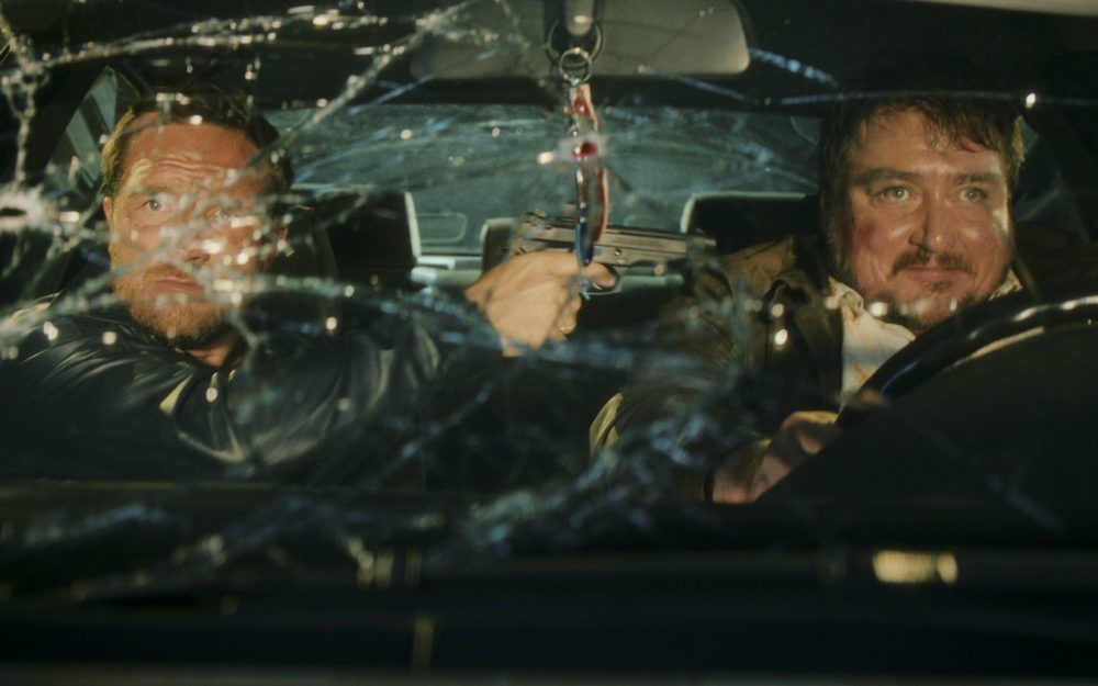 Christoph Krutzler treatening Frederick Lau with a gun in a car for the Netflix Series